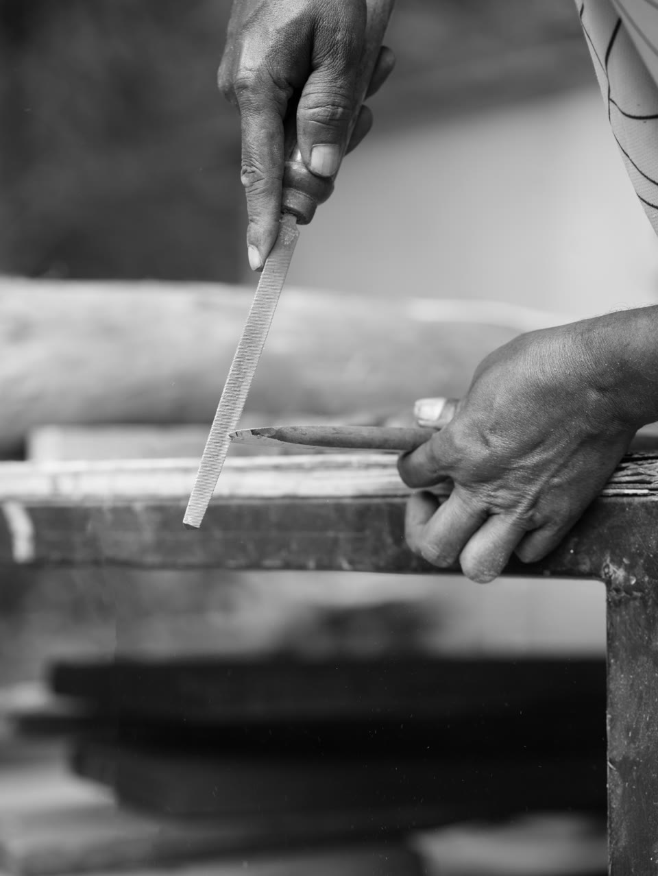 Hands filing a work in progress