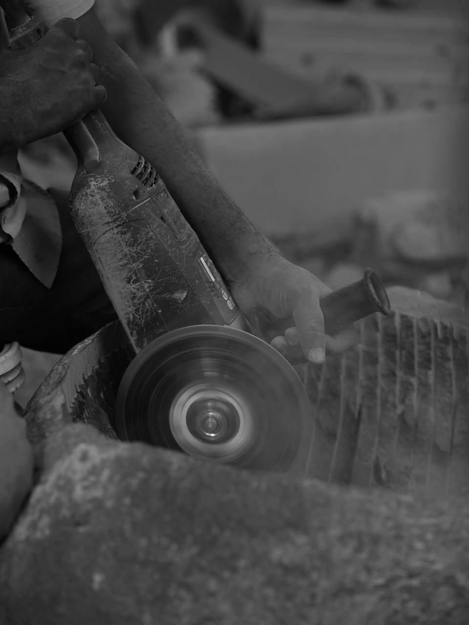 Stone being shaped with a handheld workshop tool